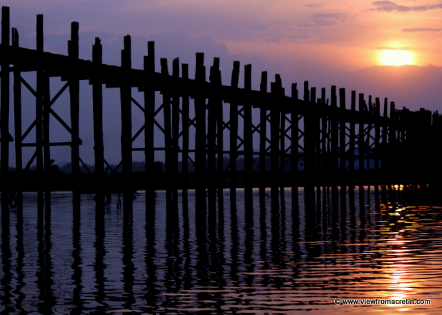 Sunset casts a glow over U Bein's Bridge in Amarapura, Myanmar.